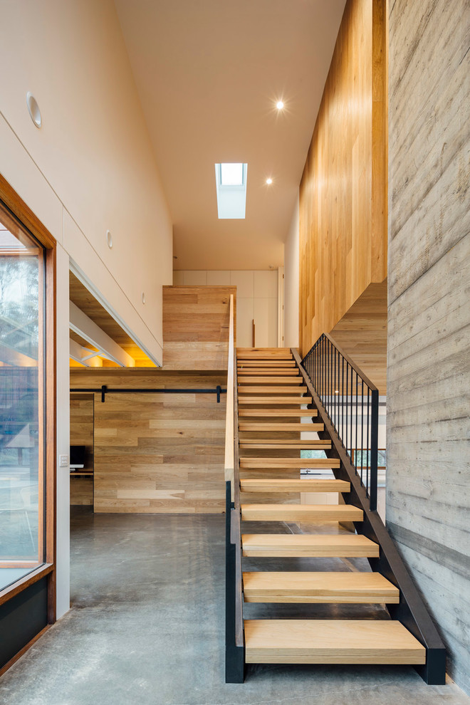 Design ideas for a mid-sized contemporary wood straight staircase in Melbourne with open risers.