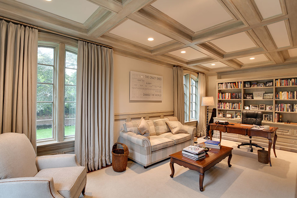 This is an example of a large traditional study room in Other with white walls, carpet, a freestanding desk, beige floor and no fireplace.