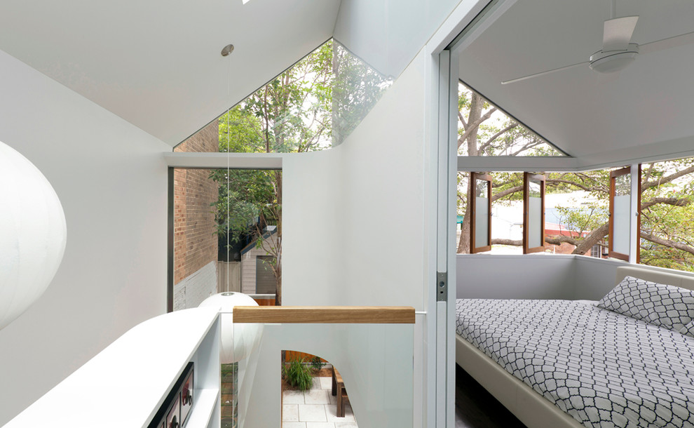 This is an example of a contemporary bedroom in Sydney.
