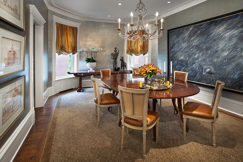 This is an example of a traditional dining room in Chicago with grey walls and dark hardwood floors.
