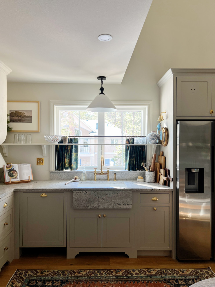 Inspiration for a small traditional l-shaped eat-in kitchen in Other with an undermount sink, shaker cabinets, grey cabinets, panelled appliances, light hardwood floors, no island, brown floor and grey benchtop.