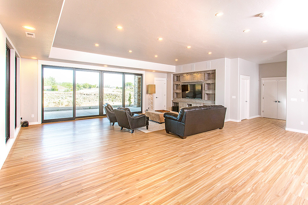Photo of an expansive modern walk-out basement in Boise.