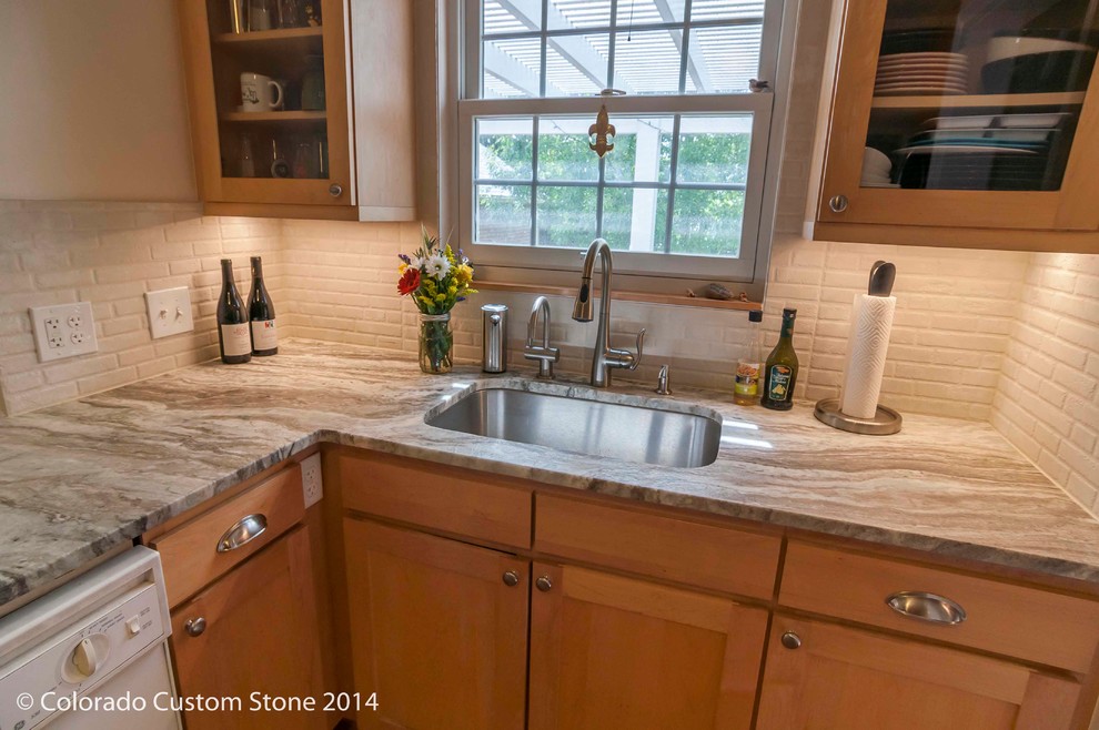 Example of a transitional home design design in Denver