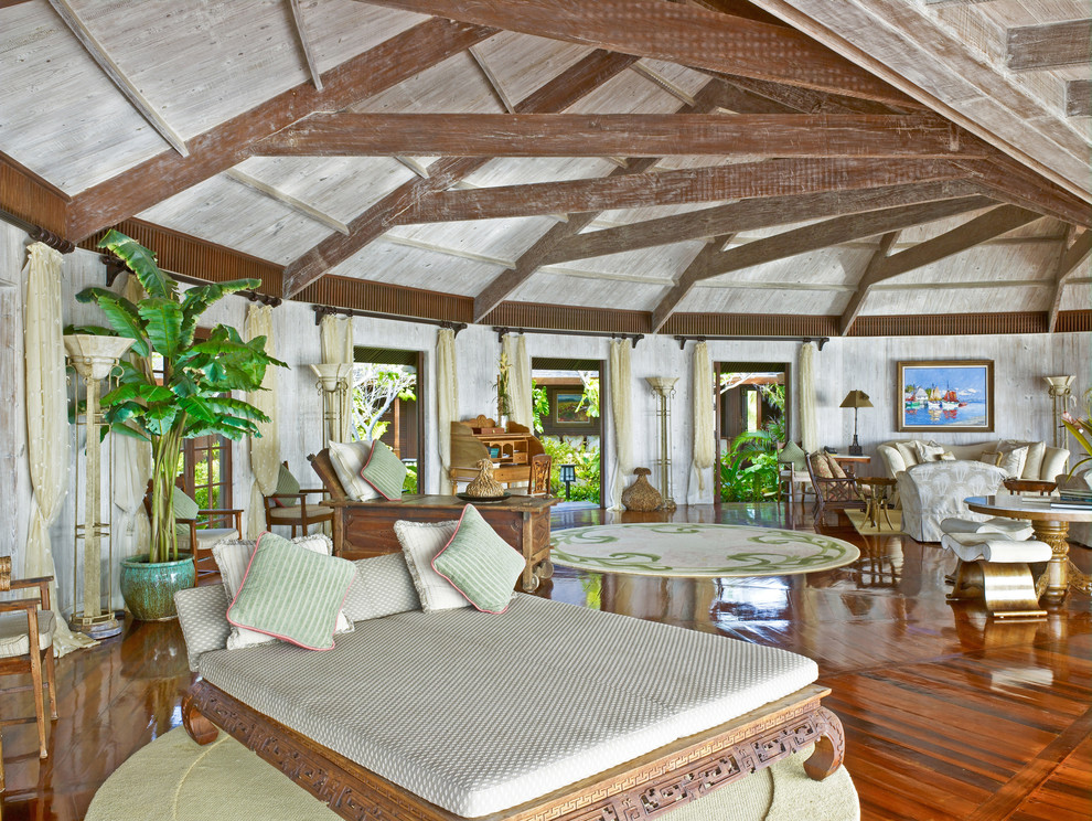 Photo of a mediterranean open concept living room in Miami with dark hardwood floors.