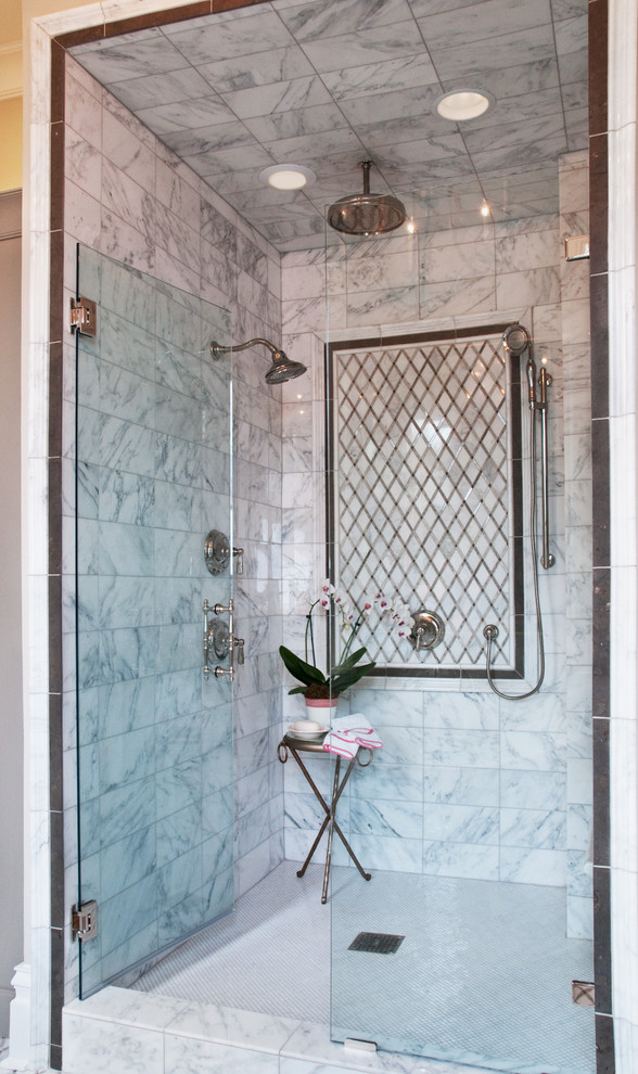 This is an example of a mid-sized transitional master bathroom in Nashville with grey cabinets, an alcove shower, white tile, marble and a hinged shower door.