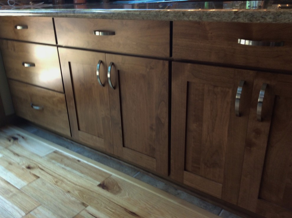 Mountain style light wood floor eat-in kitchen photo in Chicago with shaker cabinets, medium tone wood cabinets and quartz countertops