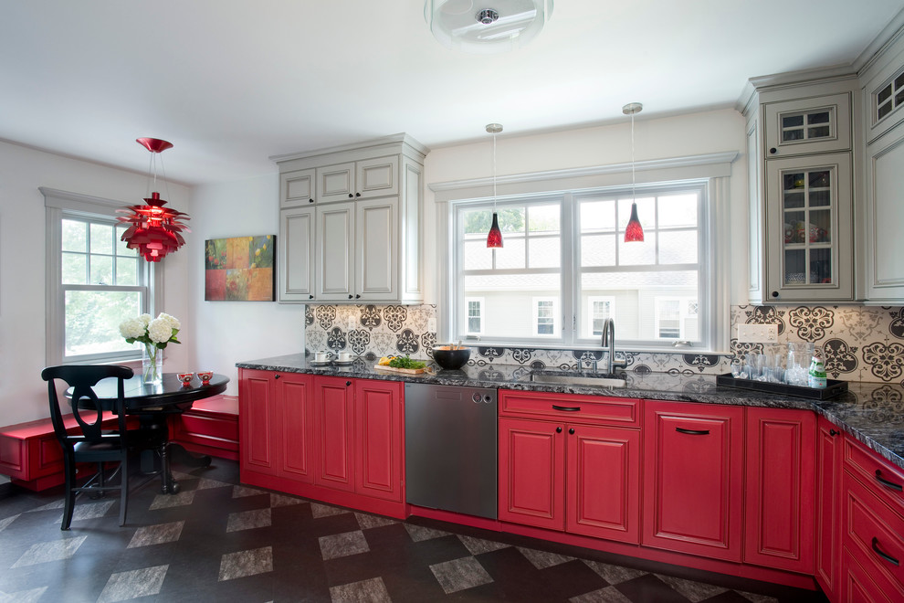 Photo of a mid-sized eclectic l-shaped eat-in kitchen in Boston with an undermount sink, raised-panel cabinets, red cabinets, granite benchtops, ceramic splashback, stainless steel appliances, linoleum floors, no island and grey splashback.