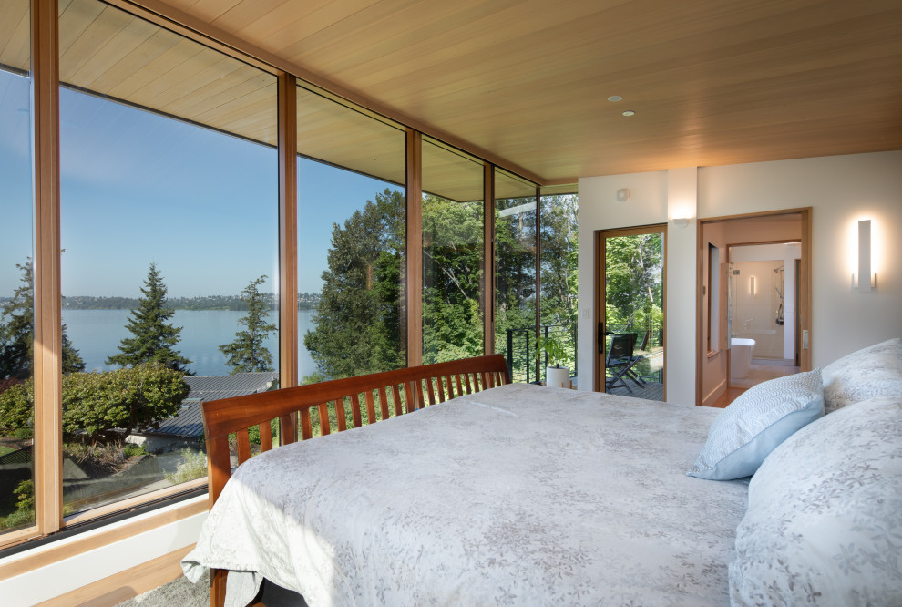Photo of a large contemporary master bedroom in Seattle with a wood ceiling.