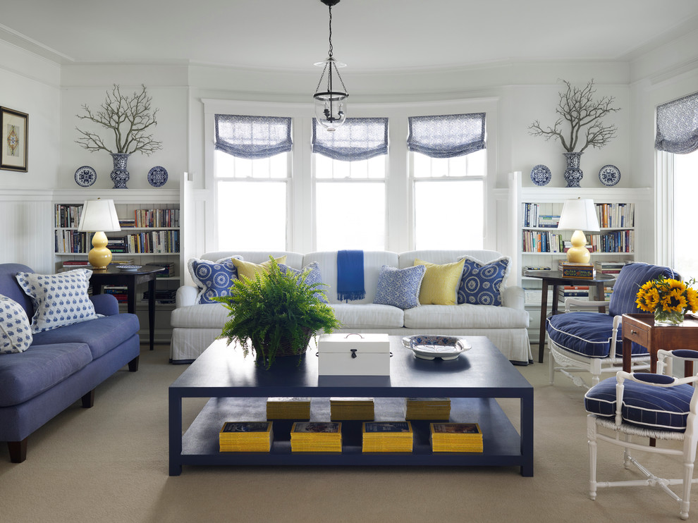 Design ideas for a beach style living room in Chicago with white walls and carpet.