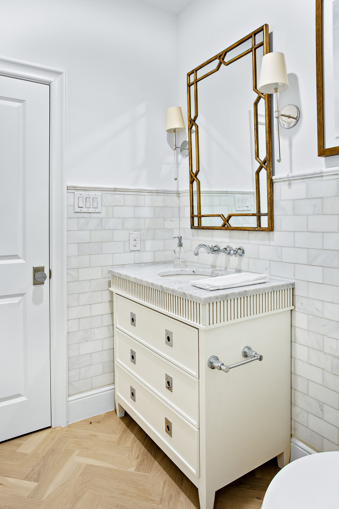 Inspiration for an expansive transitional kids bathroom in Dallas with shaker cabinets, light wood cabinets, an alcove shower, a two-piece toilet, white tile, white walls, light hardwood floors, brown floor, grey benchtops, a single vanity, a freestanding vanity, an undermount sink and a hinged shower door.