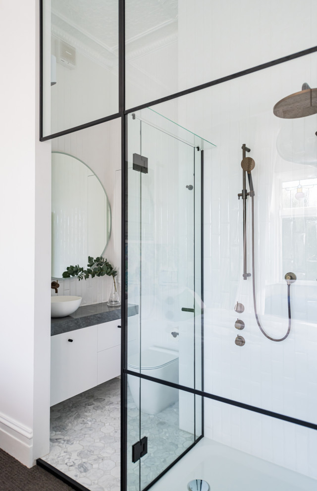 Small trendy master white tile and subway tile marble floor, gray floor, single-sink and coffered ceiling double shower photo in Wellington with white cabinets, white walls, a vessel sink, quartz countertops, a hinged shower door, gray countertops, a niche and a built-in vanity