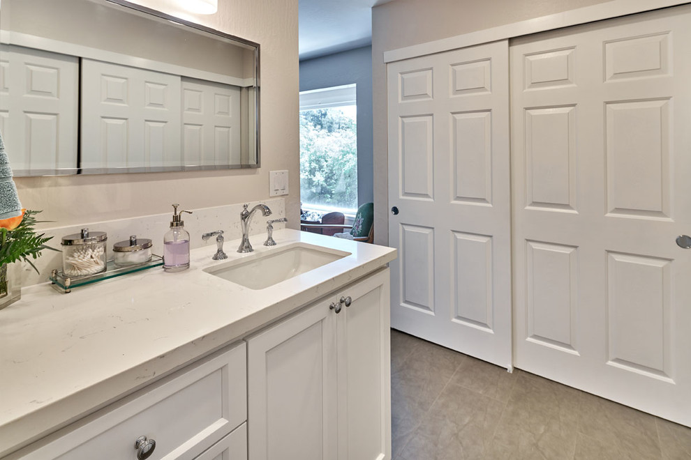 Mid-sized transitional master beige tile and glass tile doorless shower photo in San Francisco with shaker cabinets, white cabinets, a two-piece toilet, beige walls, an undermount sink and quartzite countertops
