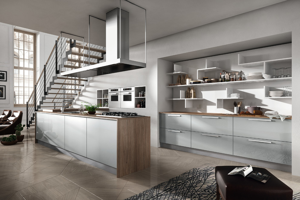 Mid-sized modern galley kitchen pantry in San Diego with a double-bowl sink, open cabinets, grey cabinets, wood benchtops, grey splashback, ceramic splashback, stainless steel appliances, medium hardwood floors and with island.