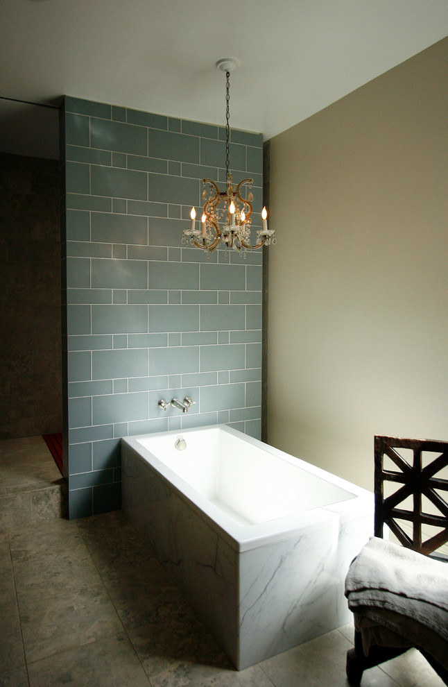 This is an example of a mid-sized contemporary master bathroom in Chicago with shaker cabinets, a drop-in tub, an open shower, blue tile, ceramic tile, beige walls and marble floors.
