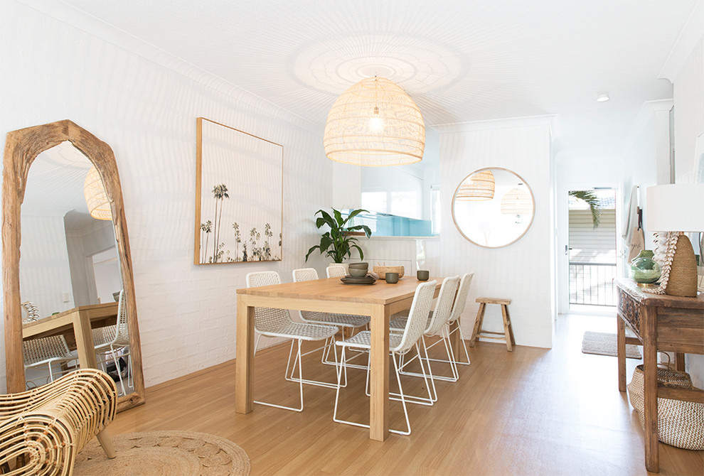 Inspiration for a beach style dining room in Brisbane.