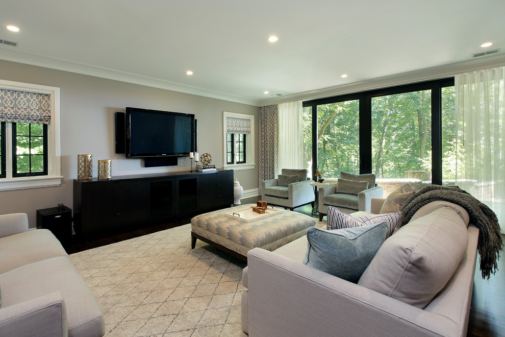 Contemporary family room in Other with grey walls.