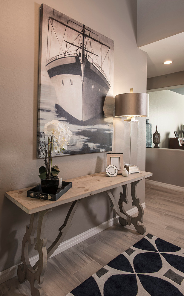 Small transitional porcelain tile front door photo in Phoenix with beige walls