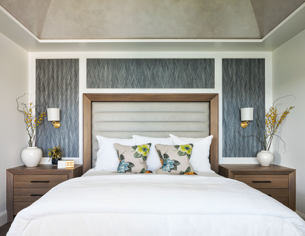This is an example of a beach style master bedroom in Minneapolis with grey walls and no fireplace.