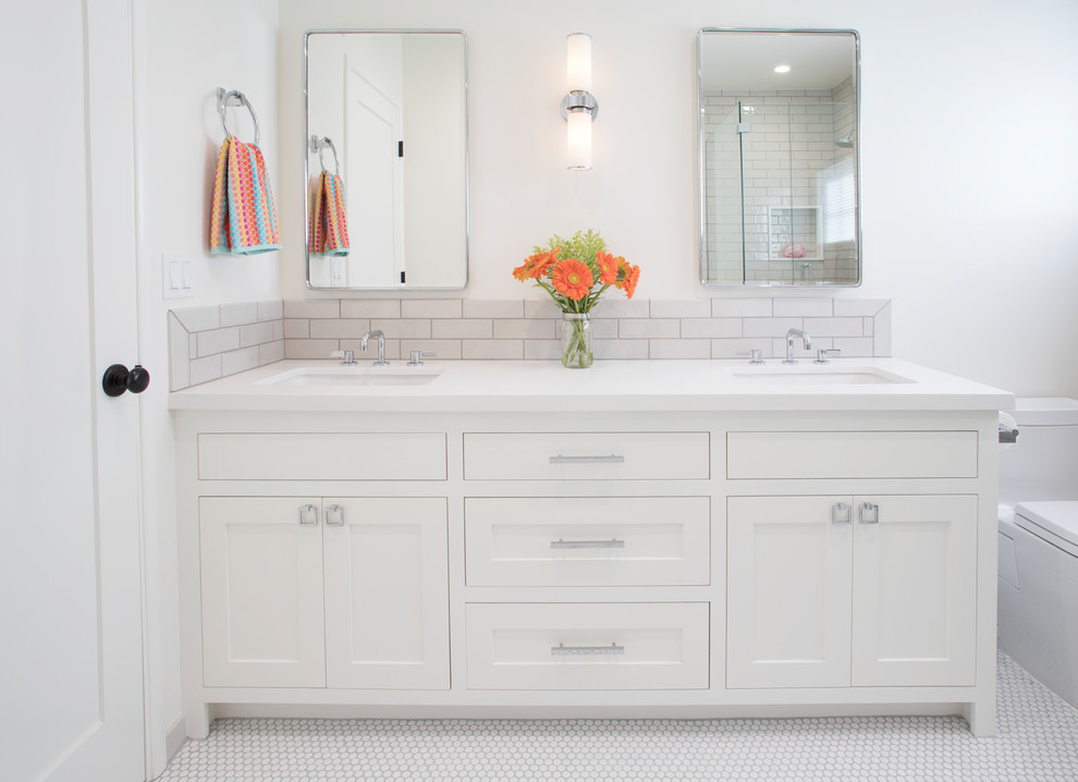 This is an example of a transitional bathroom in Los Angeles with shaker cabinets, white cabinets, white tile, subway tile, ceramic floors, engineered quartz benchtops and white floor.