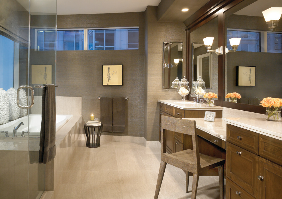 Inspiration for a contemporary bathroom in Chicago with shaker cabinets, medium wood cabinets, a corner shower, beige tile, brown walls and a drop-in tub.