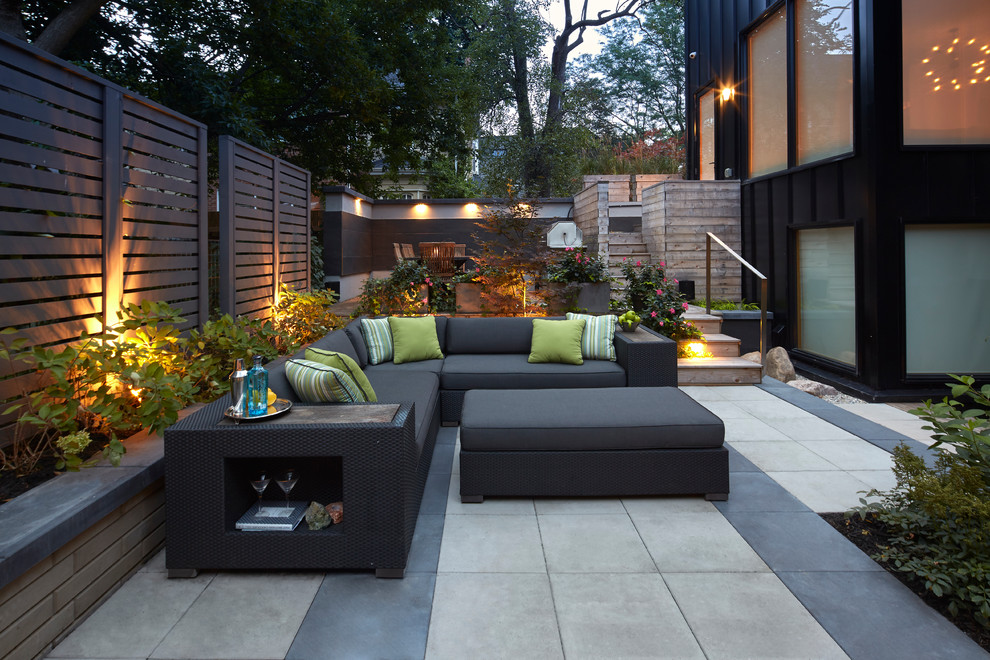 Design ideas for a contemporary patio in Toronto with concrete slab and no cover.