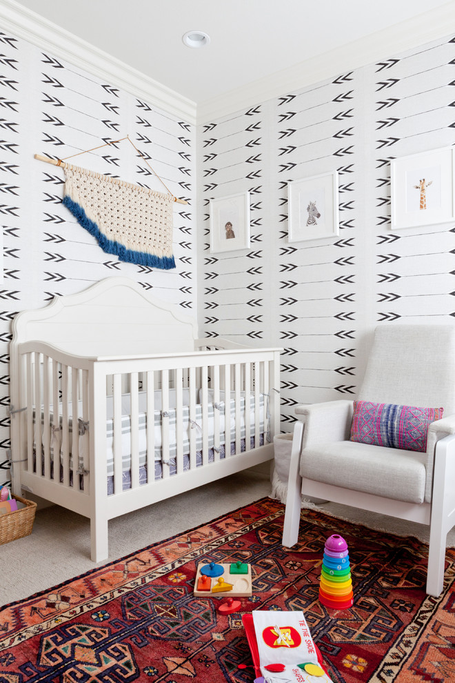 This is an example of a transitional gender-neutral nursery in Los Angeles with multi-coloured walls.