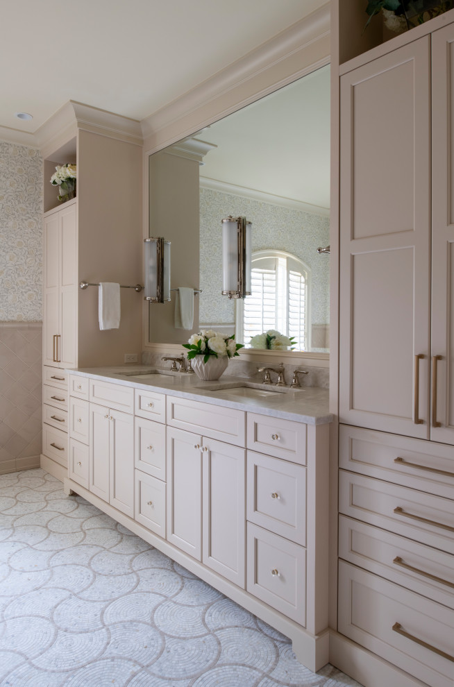 Design ideas for a large traditional master bathroom in Minneapolis with recessed-panel cabinets, beige cabinets, an alcove shower, a one-piece toilet, beige tile, ceramic tile, beige walls, ceramic floors, an undermount sink, white floor, a hinged shower door, an enclosed toilet, a double vanity and a built-in vanity.