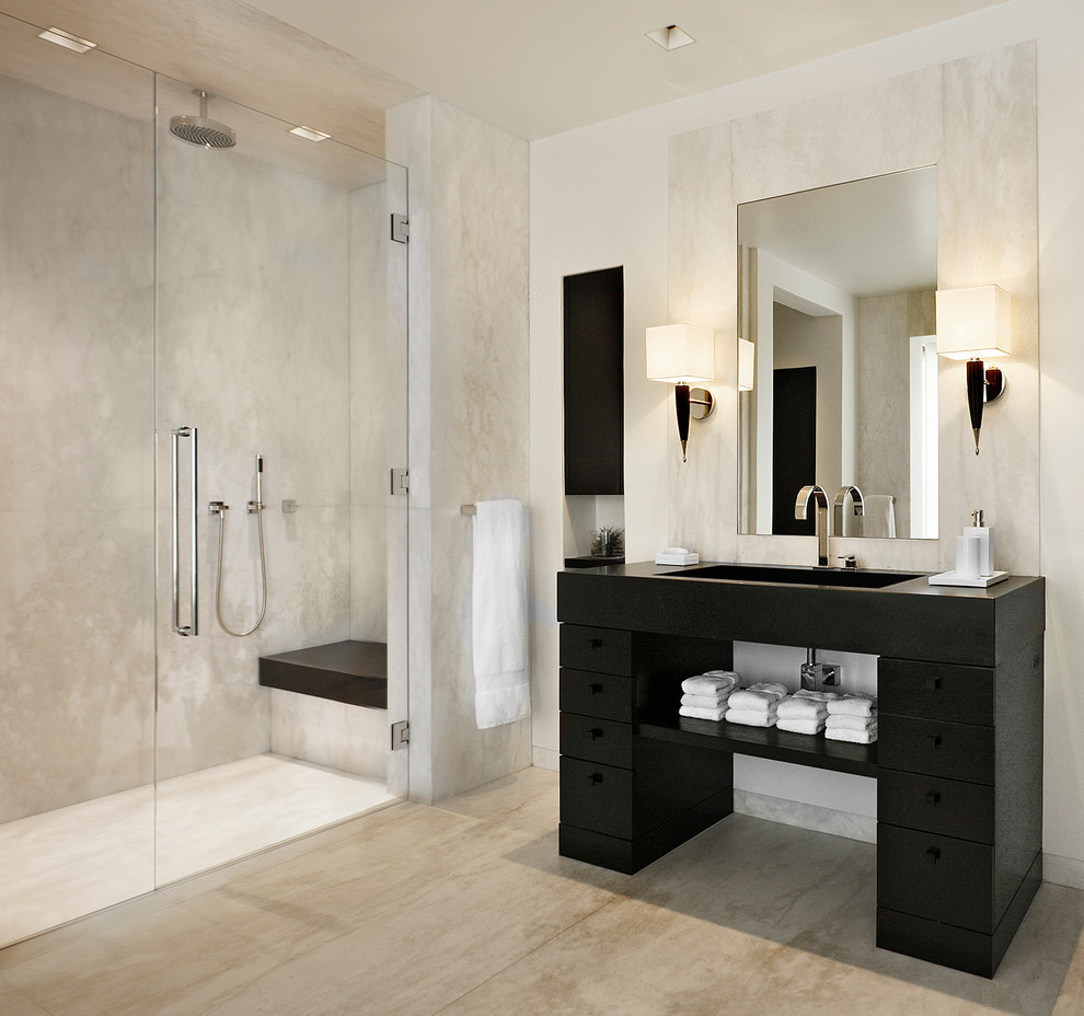 This is an example of a contemporary bathroom in Santa Barbara with flat-panel cabinets, black cabinets, a curbless shower, beige tile and white walls.