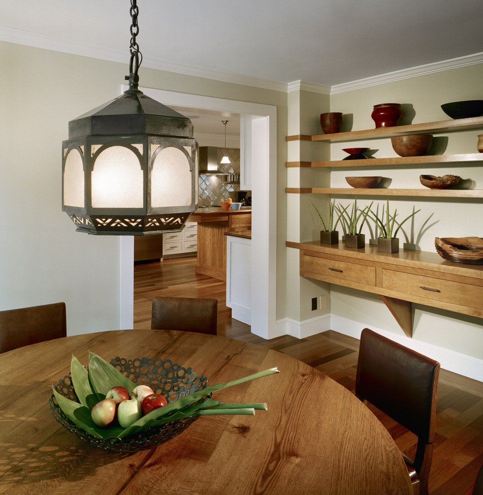 Design ideas for a country separate dining room in Boston with beige walls and dark hardwood floors.