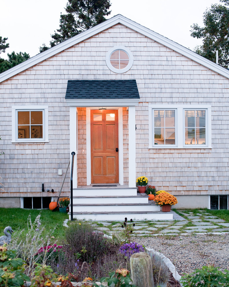 Photo of a beach style entryway in Portland Maine with a single front door.