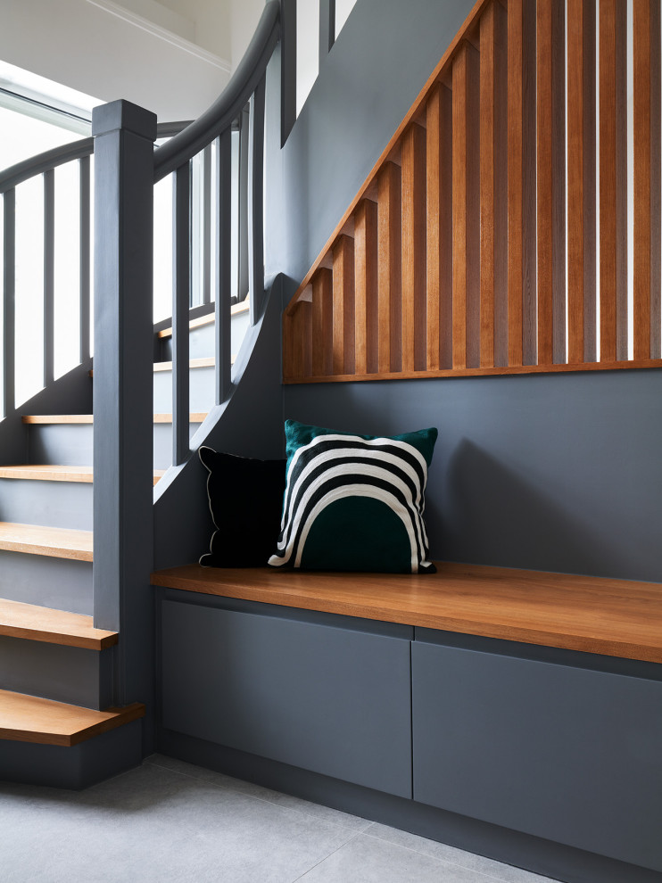 Design ideas for a medium sized contemporary wood wood railing staircase in Paris with painted wood risers.