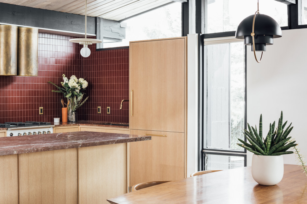Design ideas for a mid-sized midcentury l-shaped eat-in kitchen in Salt Lake City with an integrated sink, flat-panel cabinets, light wood cabinets, marble benchtops, red splashback, glass tile splashback, white appliances, terrazzo floors, a peninsula, grey floor, red benchtop and exposed beam.