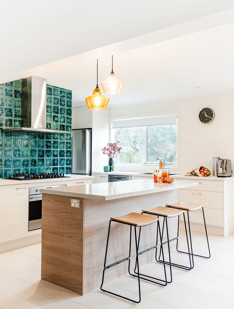 Mid-sized contemporary l-shaped kitchen in Melbourne with an undermount sink, white cabinets, quartz benchtops, porcelain splashback, stainless steel appliances, porcelain floors, with island, beige floor, beige benchtop and flat-panel cabinets.