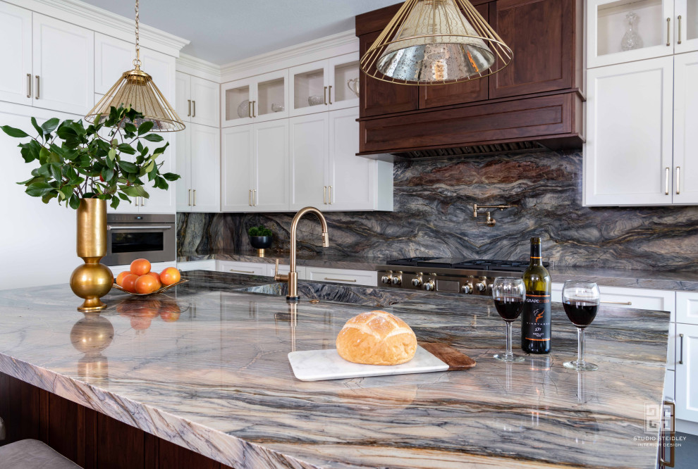 Inspiration for a mid-sized transitional l-shaped slate floor and gray floor eat-in kitchen remodel in Dallas with an integrated sink, recessed-panel cabinets, white cabinets, quartzite countertops, blue backsplash, stainless steel appliances, an island and blue countertops