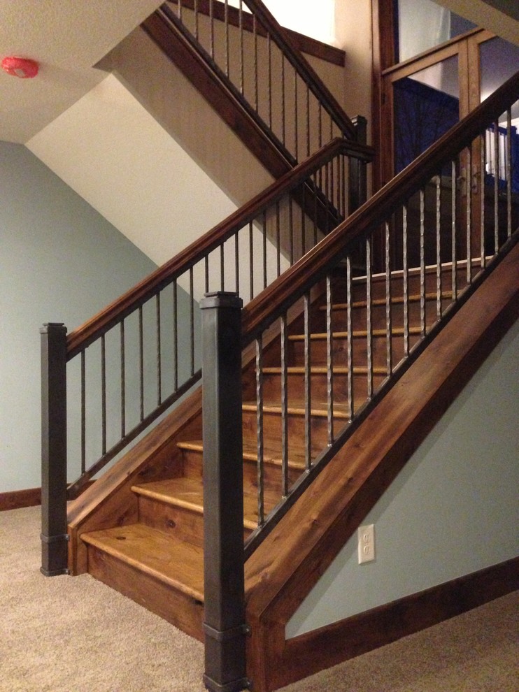 Example of a mid-sized classic wooden u-shaped staircase design in Minneapolis with wooden risers