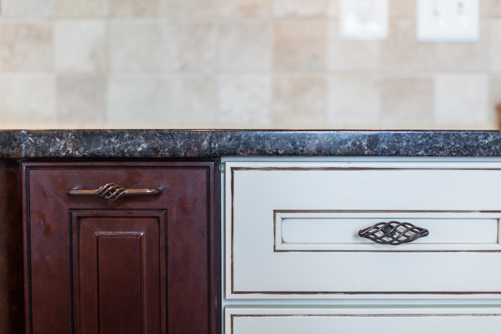 Huge transitional medium tone wood floor eat-in kitchen photo in DC Metro with raised-panel cabinets, granite countertops, stainless steel appliances and an island