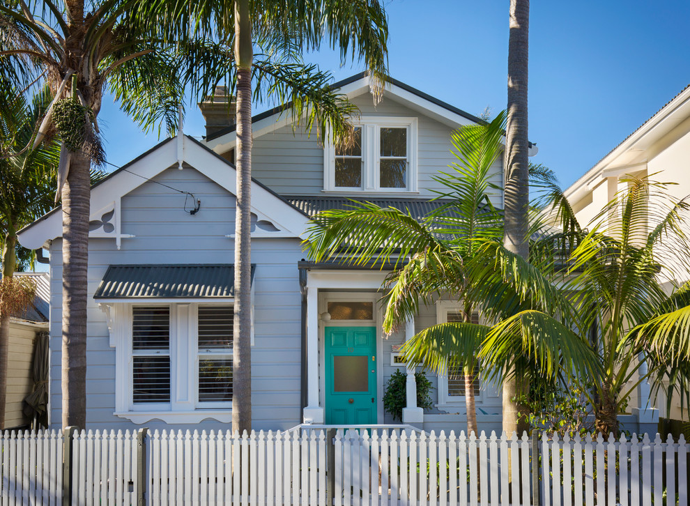 Photo of a beach style grey exterior in Sydney with mixed siding and a gable roof.