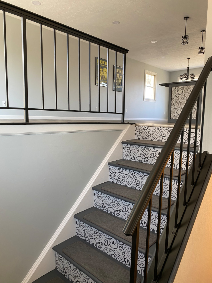 Staircase - large transitional l-shaped vinyl floor and gray floor staircase idea in Cincinnati with an undermount sink, raised-panel cabinets, white cabinets, granite countertops, multicolored backsplash, ceramic backsplash, stainless steel appliances, an island and black countertops