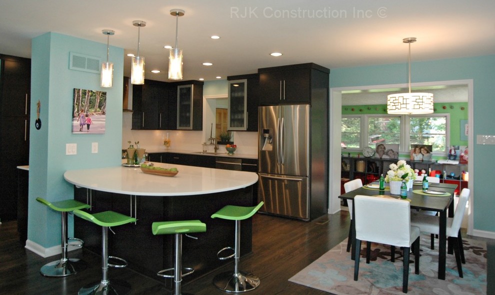 Inspiration for a modern kitchen in DC Metro with stainless steel appliances and light hardwood floors.