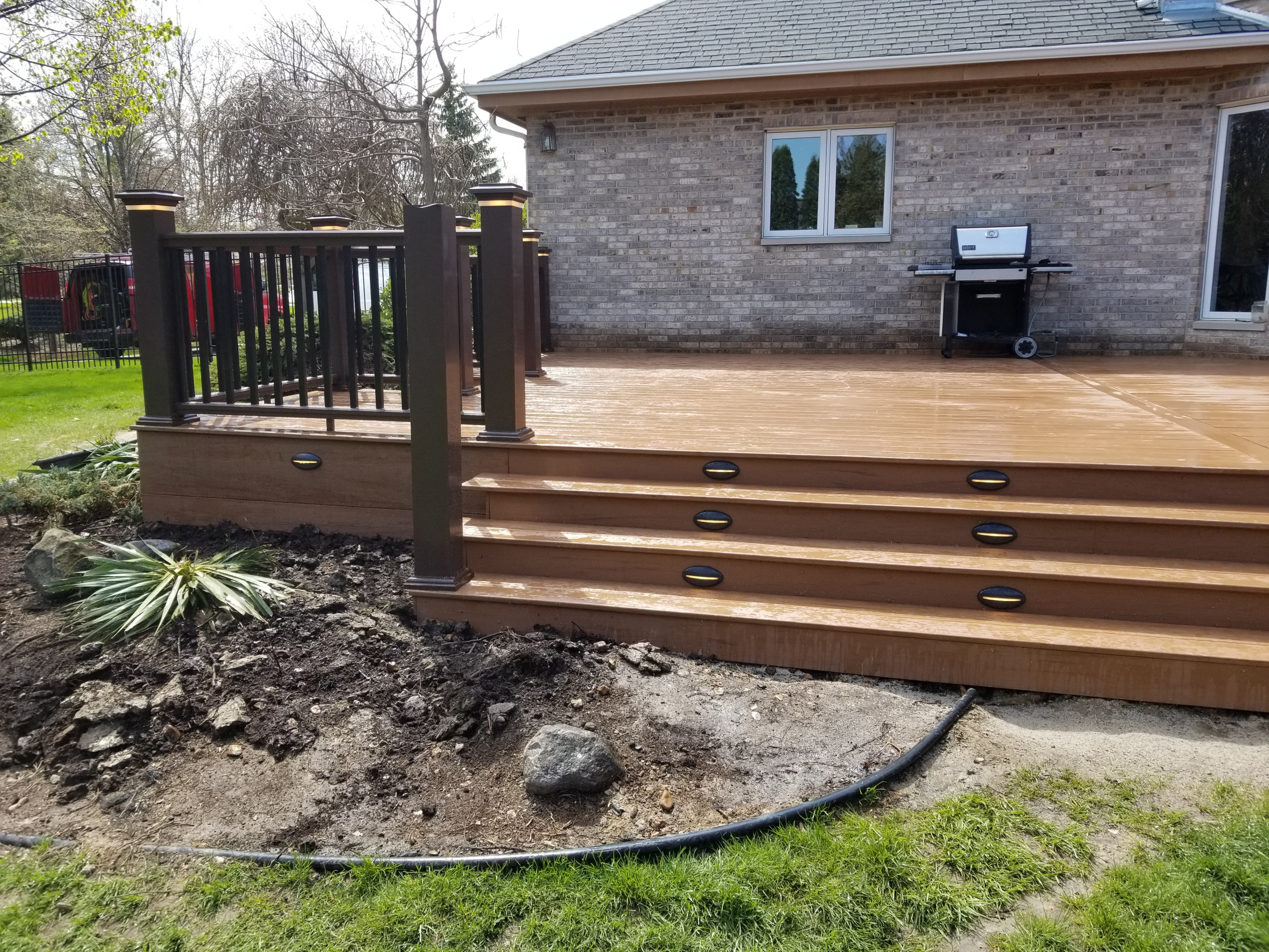 Composite deck with composite railing and lighting