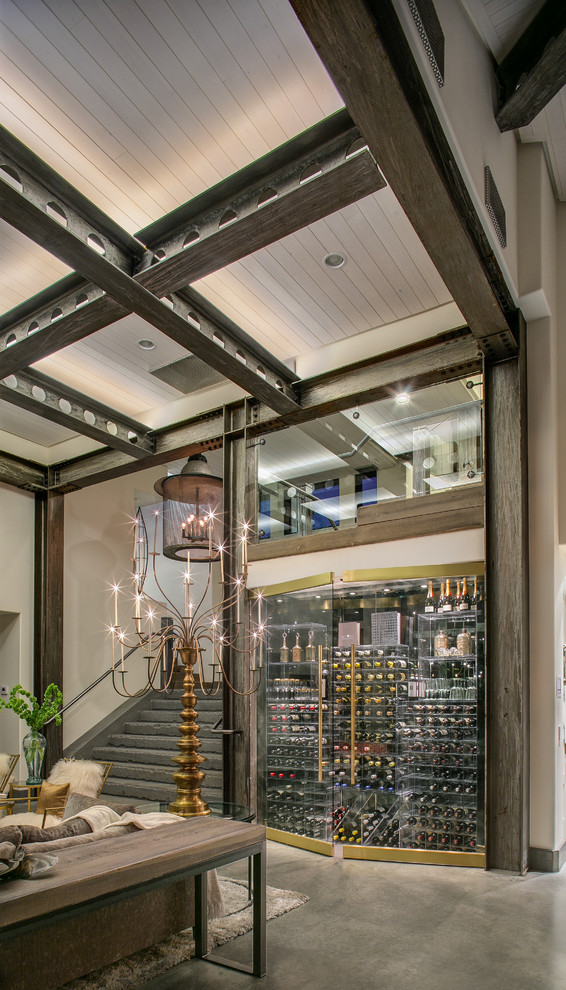 Mid-sized contemporary wine cellar in Seattle with concrete floors and display racks.