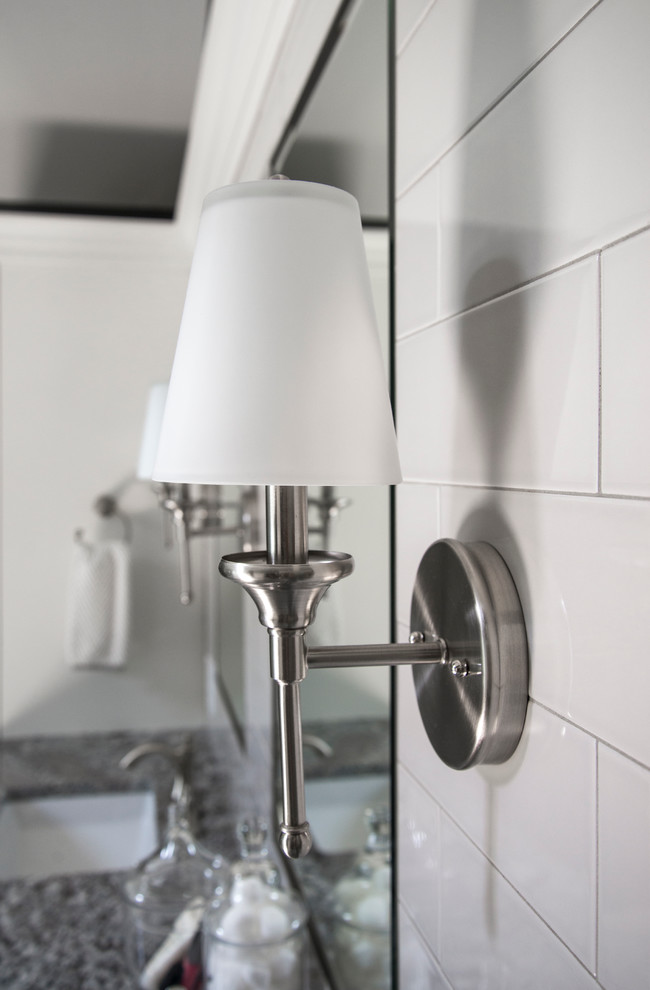 Freestanding bathtub - mid-sized transitional master gray tile and subway tile porcelain tile freestanding bathtub idea in Chicago with flat-panel cabinets, white cabinets, a two-piece toilet, gray walls, an undermount sink and granite countertops