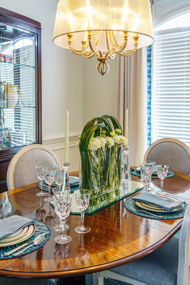 Inspiration for a mid-sized transitional medium tone wood floor and brown floor dining room remodel with white walls and no fireplace