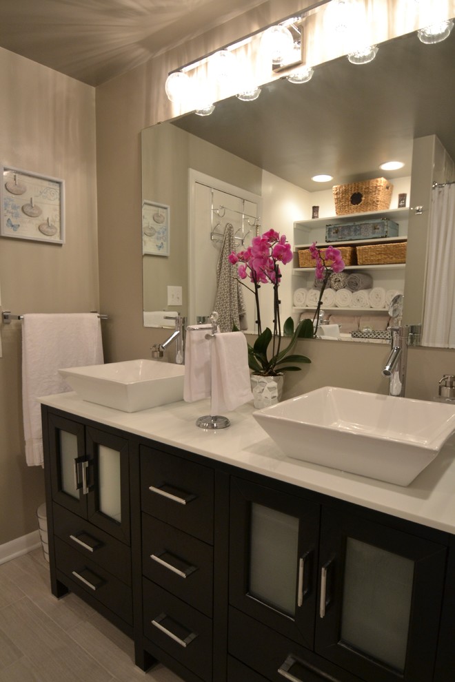 Photo of a small contemporary bathroom in Charlotte with a vessel sink, beige tile and beige walls.