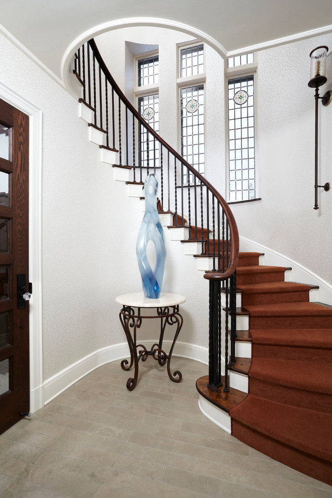 This is an example of a traditional wood curved staircase in Minneapolis.