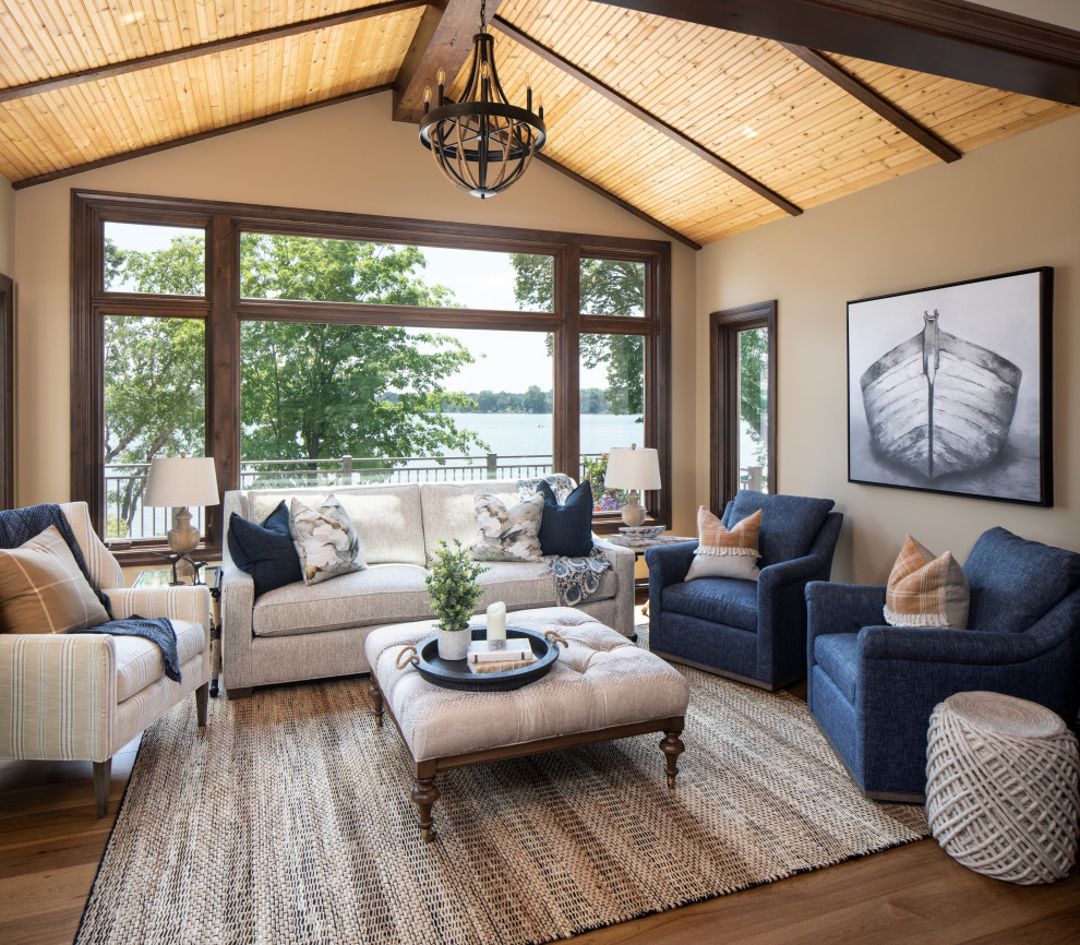 This is an example of a large rustic conservatory in Minneapolis with brown floors.