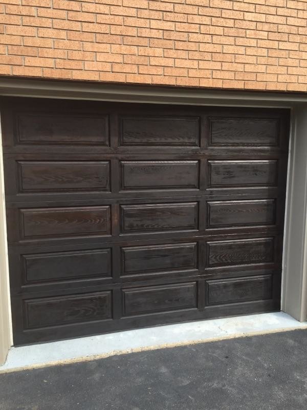 Example of a large attached garage design in New York