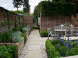 Traditional Landscape by Landscaping Solutions