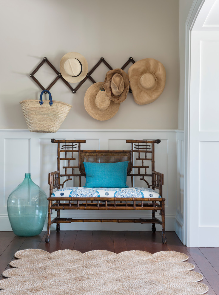 Inspiration for a beach style entryway in Providence with beige walls and dark hardwood floors.