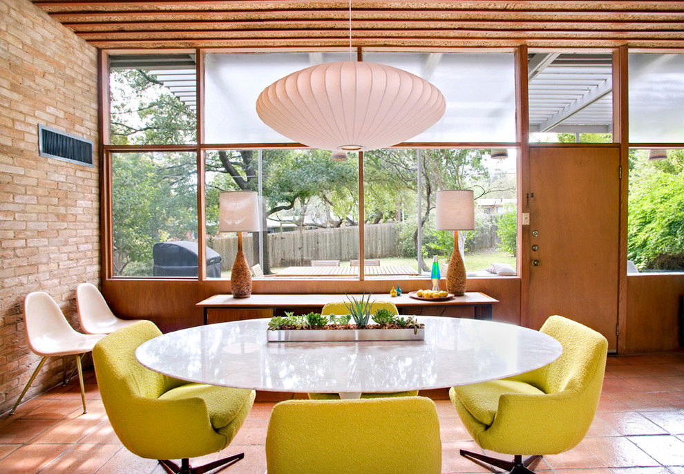 Inspiration for a large midcentury dining room in Austin.